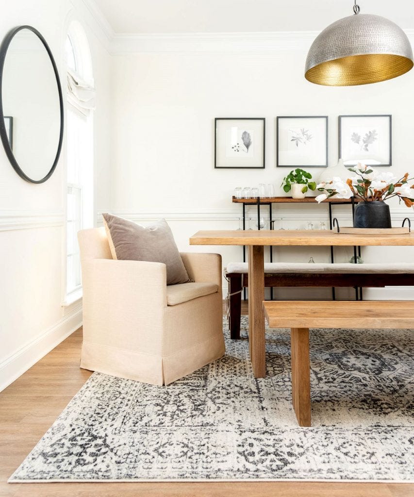 Beige coastal style rug in dining room