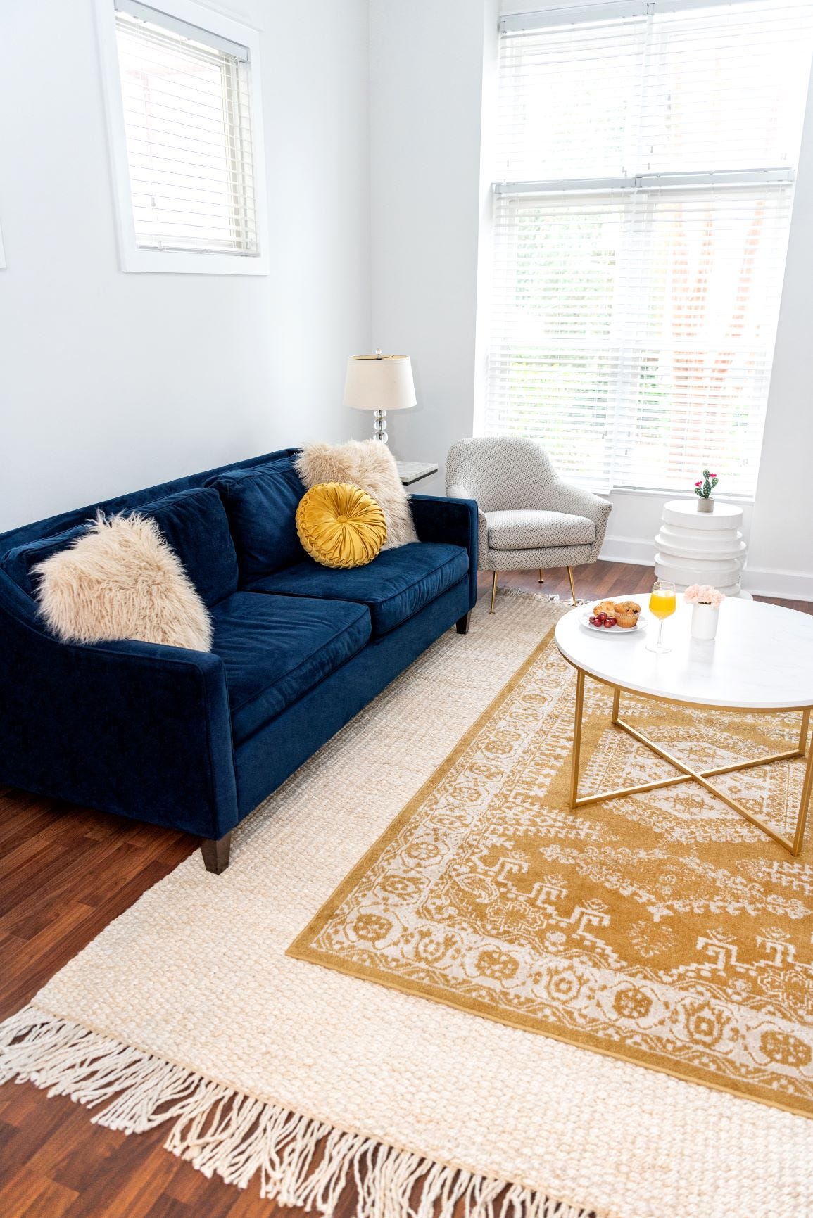 layering yellow rug on jute rug
