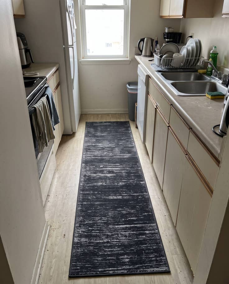 Detail image of 2' x 4' Prewitt · Linear abstract rug, black and ivory