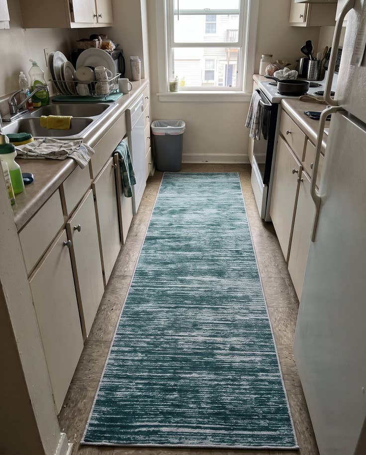Detail image of 2' x 4' Prewitt · Abstract striped rug, teal and ivory