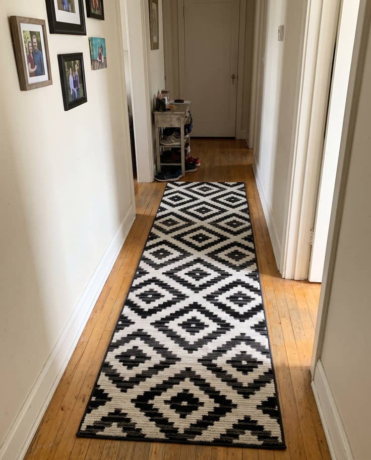 Detail image of 2' 7 x 10' Temple · Geometric diamond rug, black and ivory