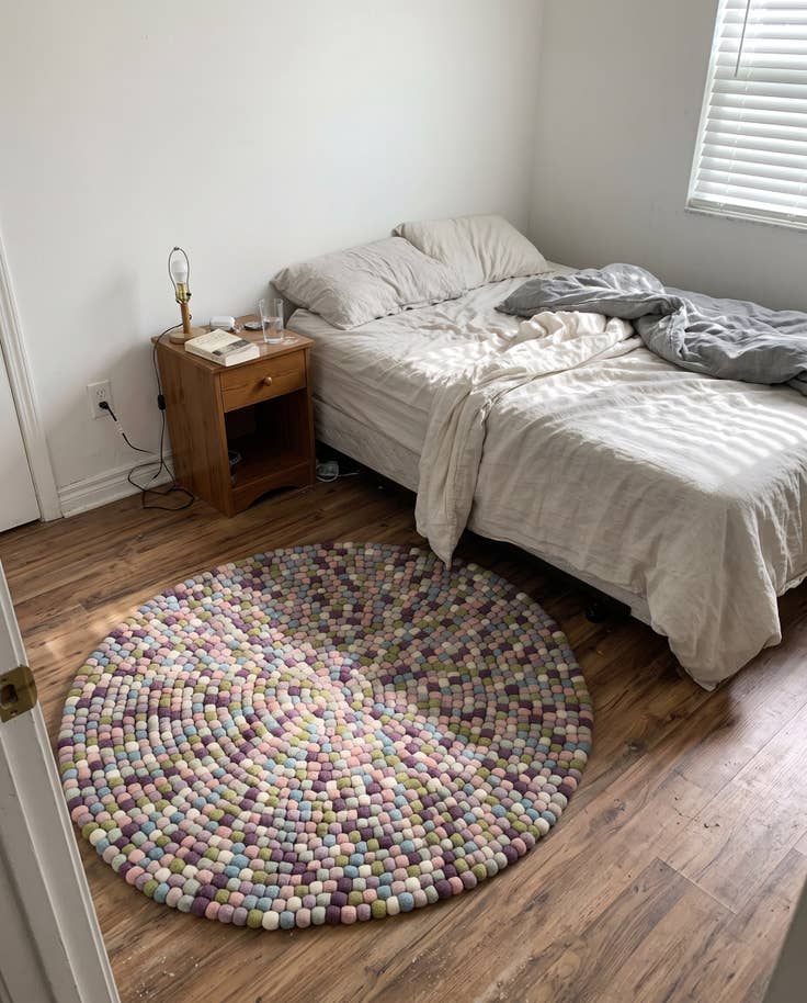 Detail image of 5' 1 x 5' 1 Hawthorne · Pebbled Wool Rug, purple and pink