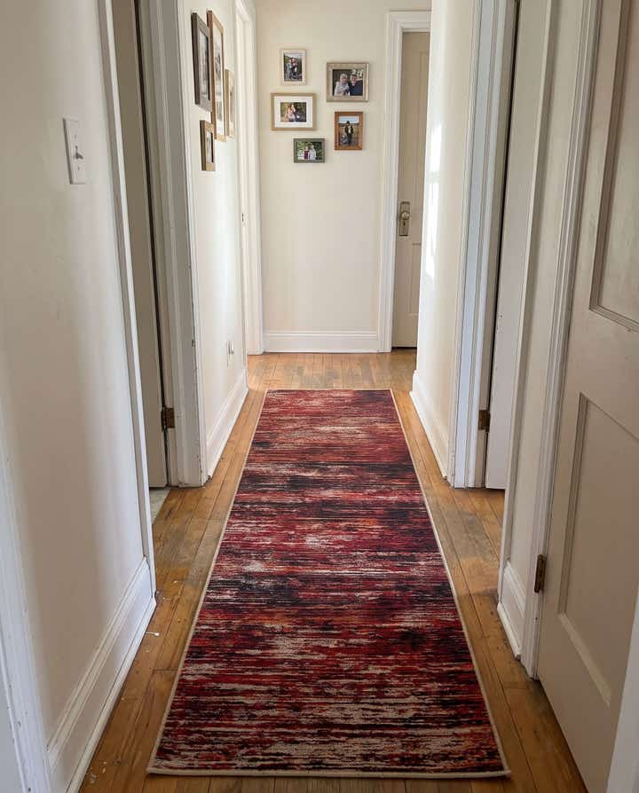 2' 6 x 16' Prewitt · Abstract rug, rust red