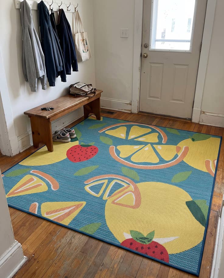 Detail image of 10' x 10' Masterson · Citrus fruit Outdoor Rug, blue and yellow
