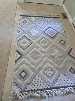 Customer photo for review titled "Rug color is more grey"