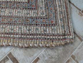 Customer photo for review titled "Beautiful soft rug for a sunroom"