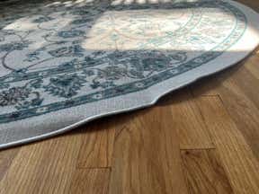 Customer photo for review titled "Very thin impossible to get to lay flat"