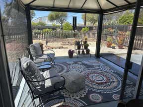 Customer photo for review titled "Gorgeous outdoor rug for my gazebo!"