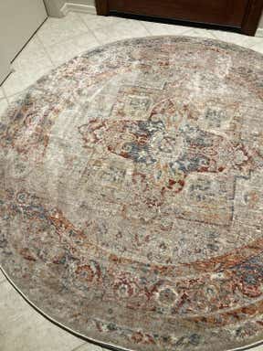 Customer photo for review titled "A beautiful and durable rug for my entryway."