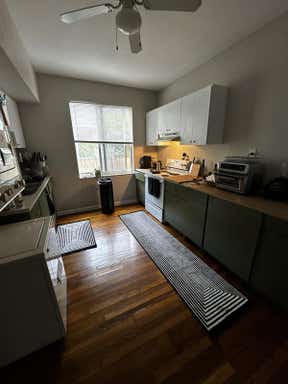 Customer photo for review titled "Great kitchen rug that adds a modern flare"