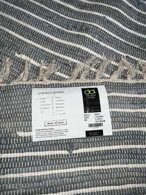 Customer photo for review titled "Rug is not light grey"