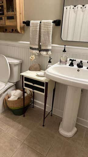 Customer photo for review titled "Beautiful accent for a black and white bathroom"
