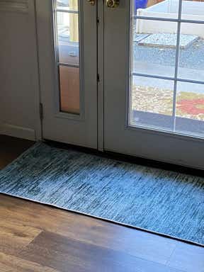 Customer photo for review titled "Pretty teal runner rugs"