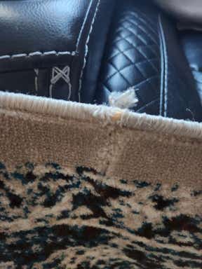 Customer photo for review titled "Nice rug but quality is poor."