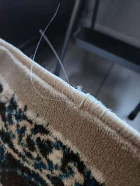 Customer photo for review titled "Nice rug but quality is poor."