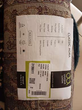 Customer photo for review titled "Nice rug but has a flaw need replacenent"