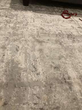 Customer photo for review titled "Lovely neutral soft rug that doesn’t lay flat"