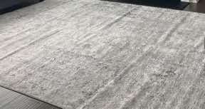 Customer photo for review titled "Lovely neutral soft rug that doesn’t lay flat"