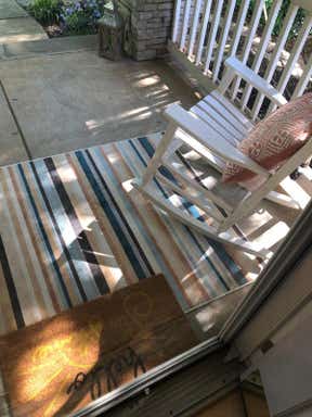 Customer photo for review titled "Adorable outdoor rug!"