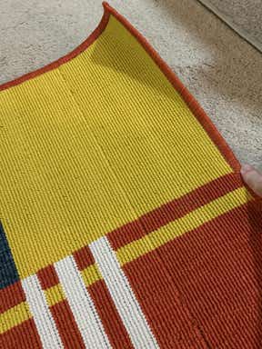 Customer photo for review titled "Rug was defective; watch for odd weave lines"