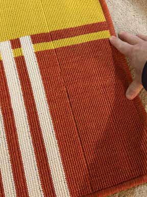 Customer photo for review titled "Rug was defective; watch for odd weave lines"