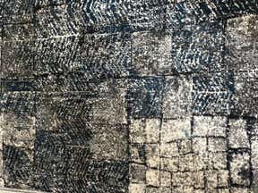 Customer photo for review titled "Color doesn’t match picture on website at all.   The rug is more green than blue."