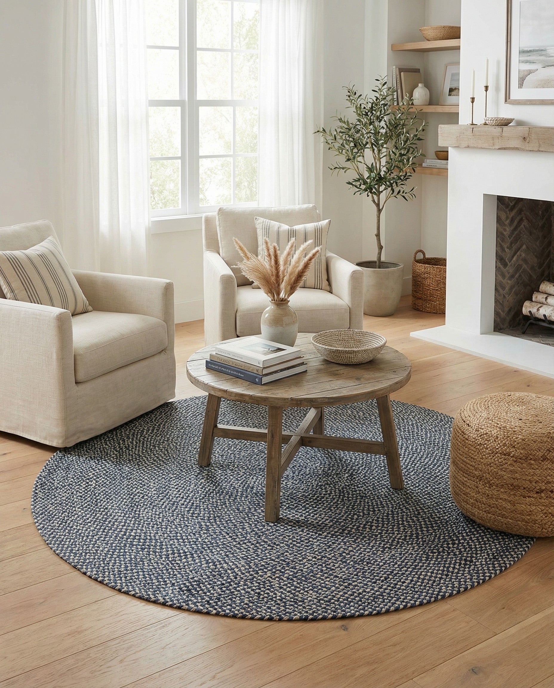 A 6' 1 round navy blue and off-white braided jute rug with a modern, textured pattern.