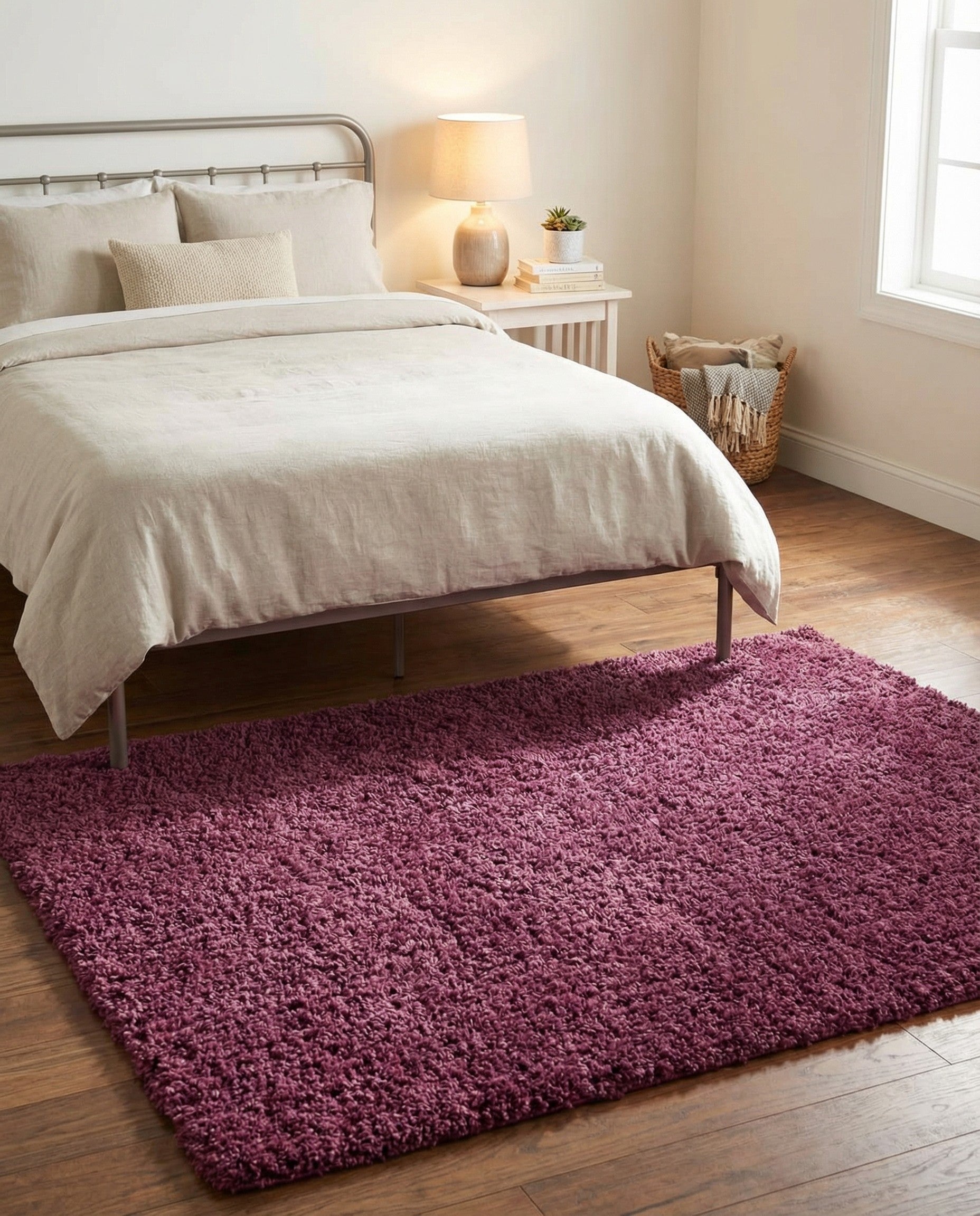 A plush 4x6 rectangular purple shag rug, ideal for adding soft texture and a vibrant pop of color to a living room or bedroom.