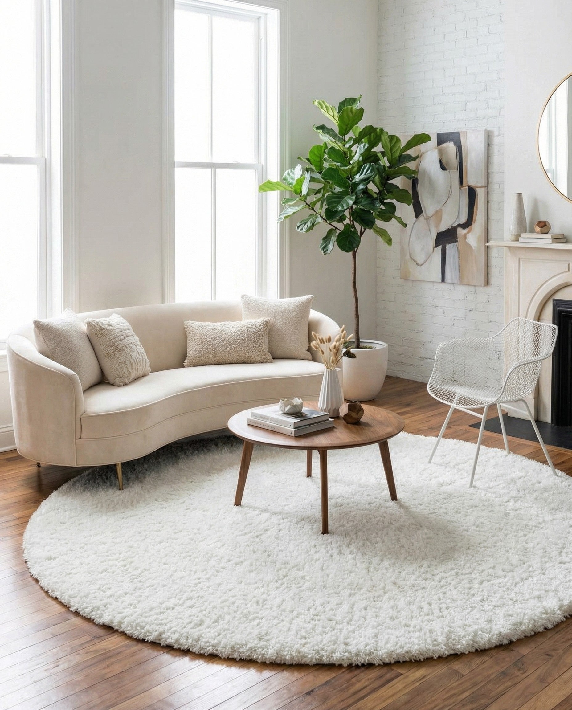 A large 10' 2 x 10' 2 round white shag rug with a soft, textured pile, suitable for a modern living space.