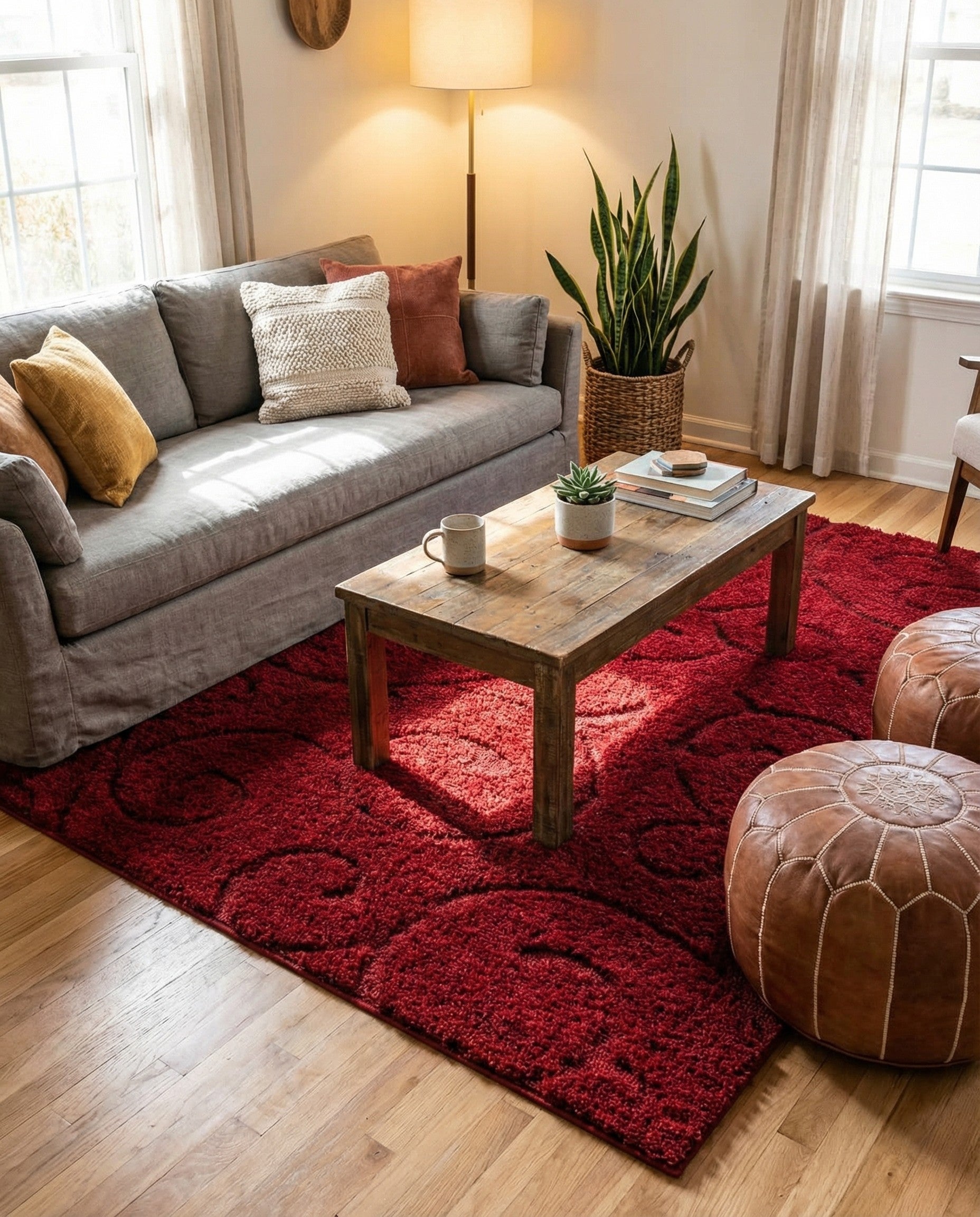 A plush 4x6 rectangular red area rug with a subtle high-low textured floral pattern, suitable for a living room.