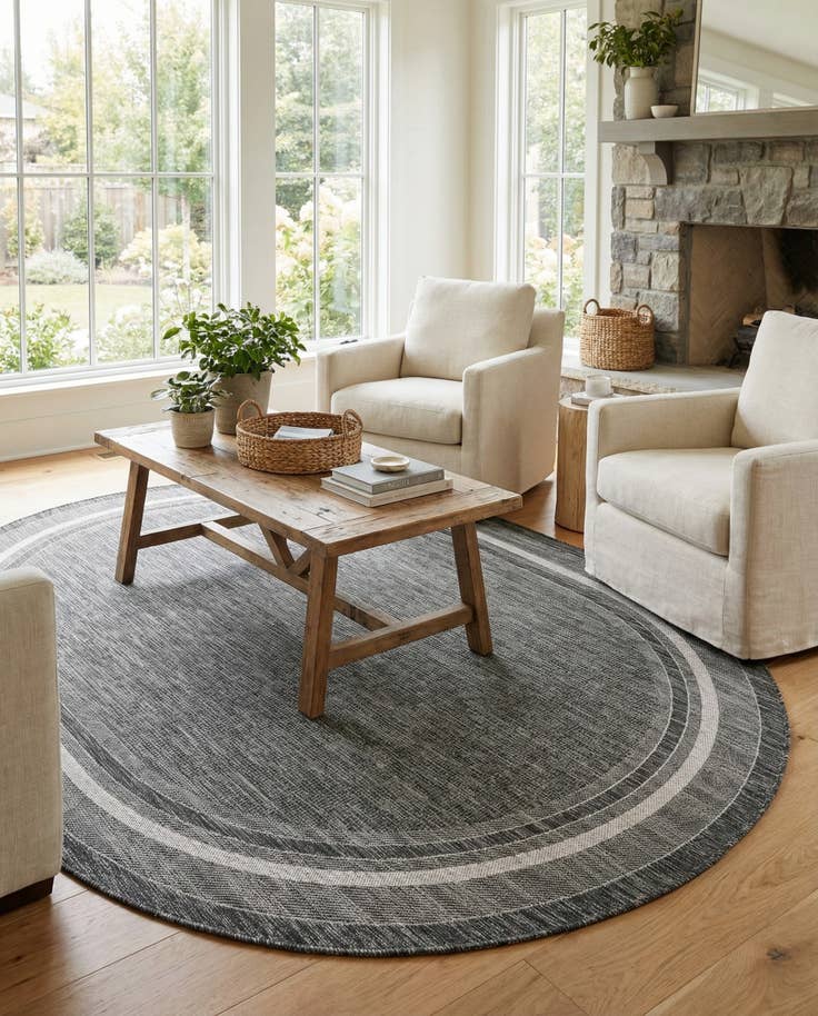 Detail image of 7' 10 x 10' Easy-Clean Border Indoor / Outdoor Oval Rug