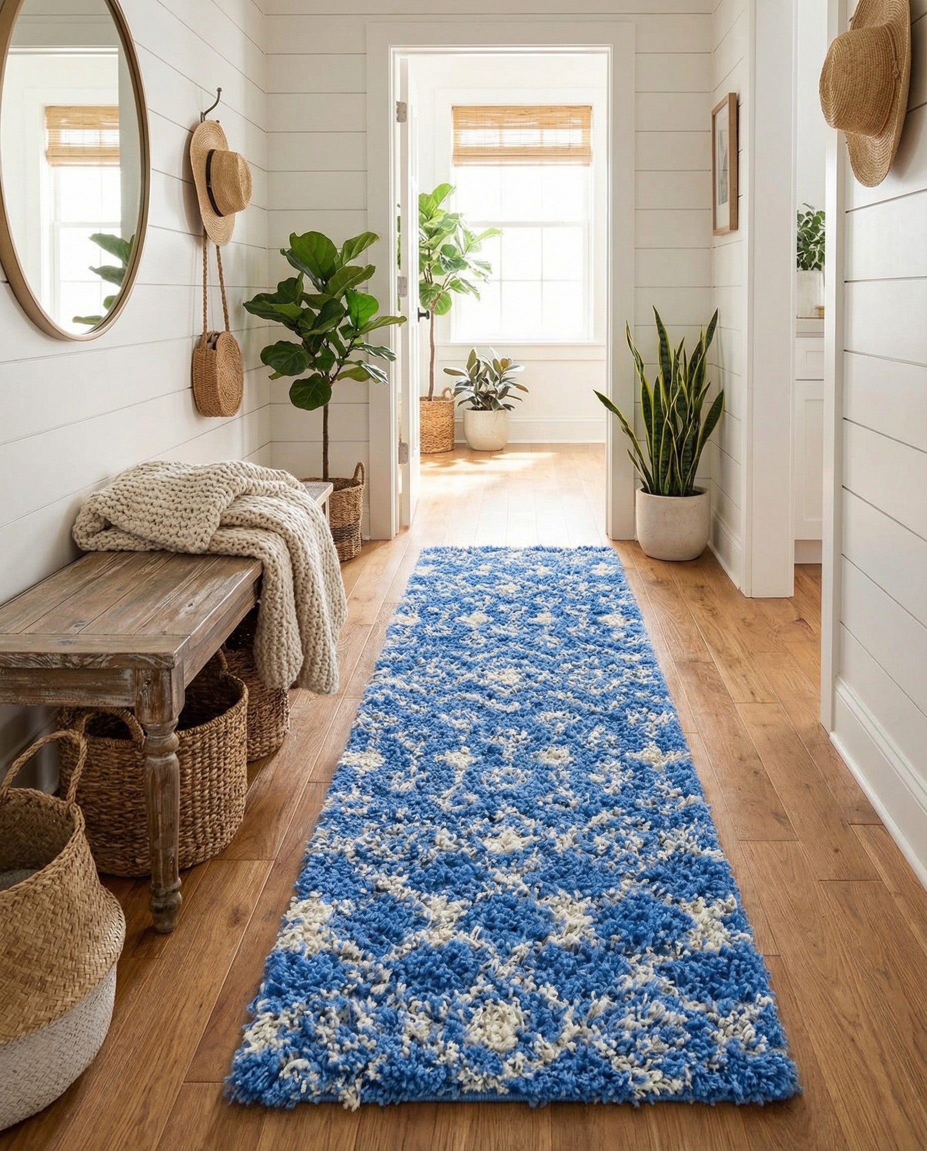 A long 12 ft blue and white shag runner rug with a tribal, modern pattern, ideal for a hallway.