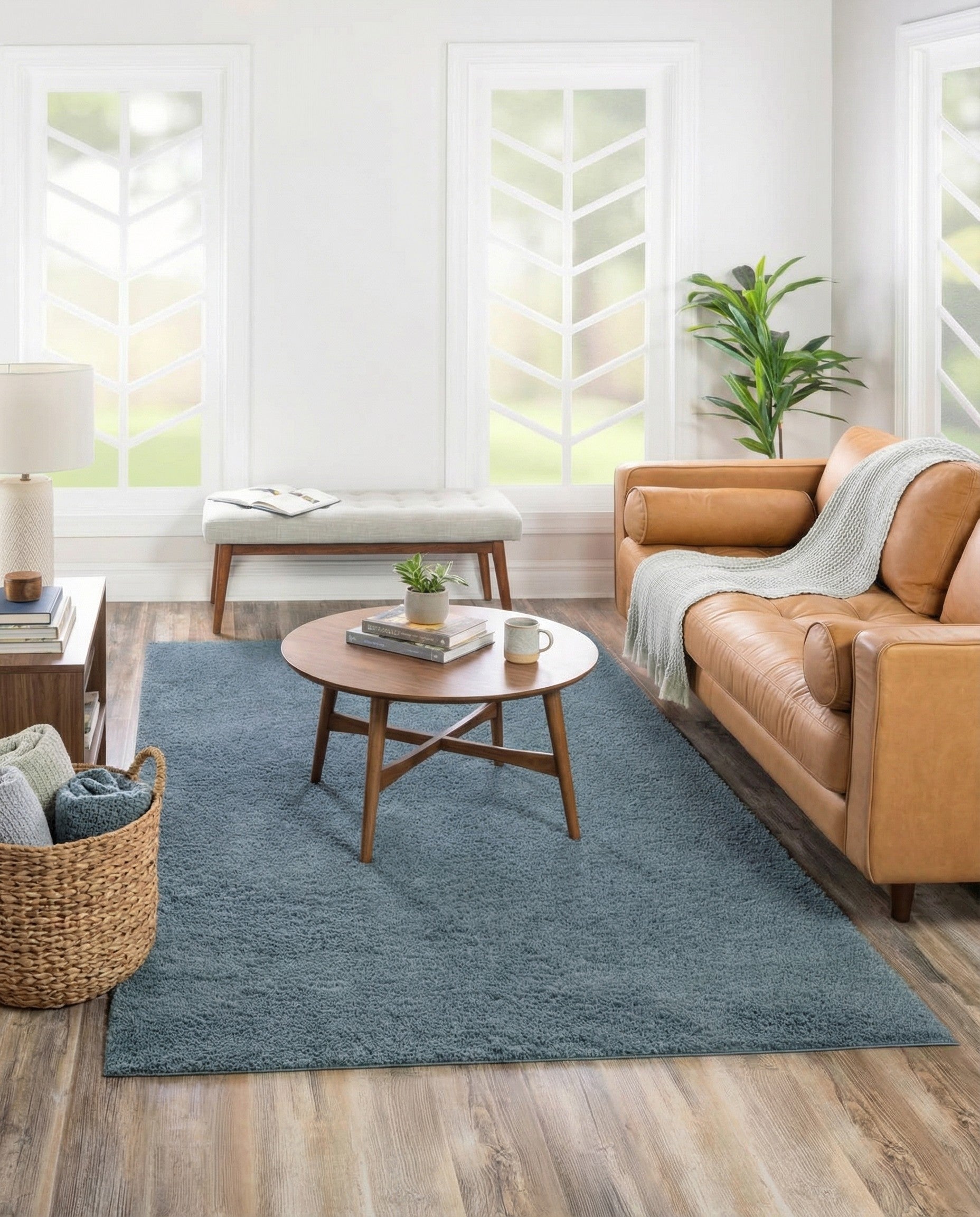 A 4x6 rectangular blue shag rug with a high, textured pile, perfect for adding comfort to a living room or bedroom.