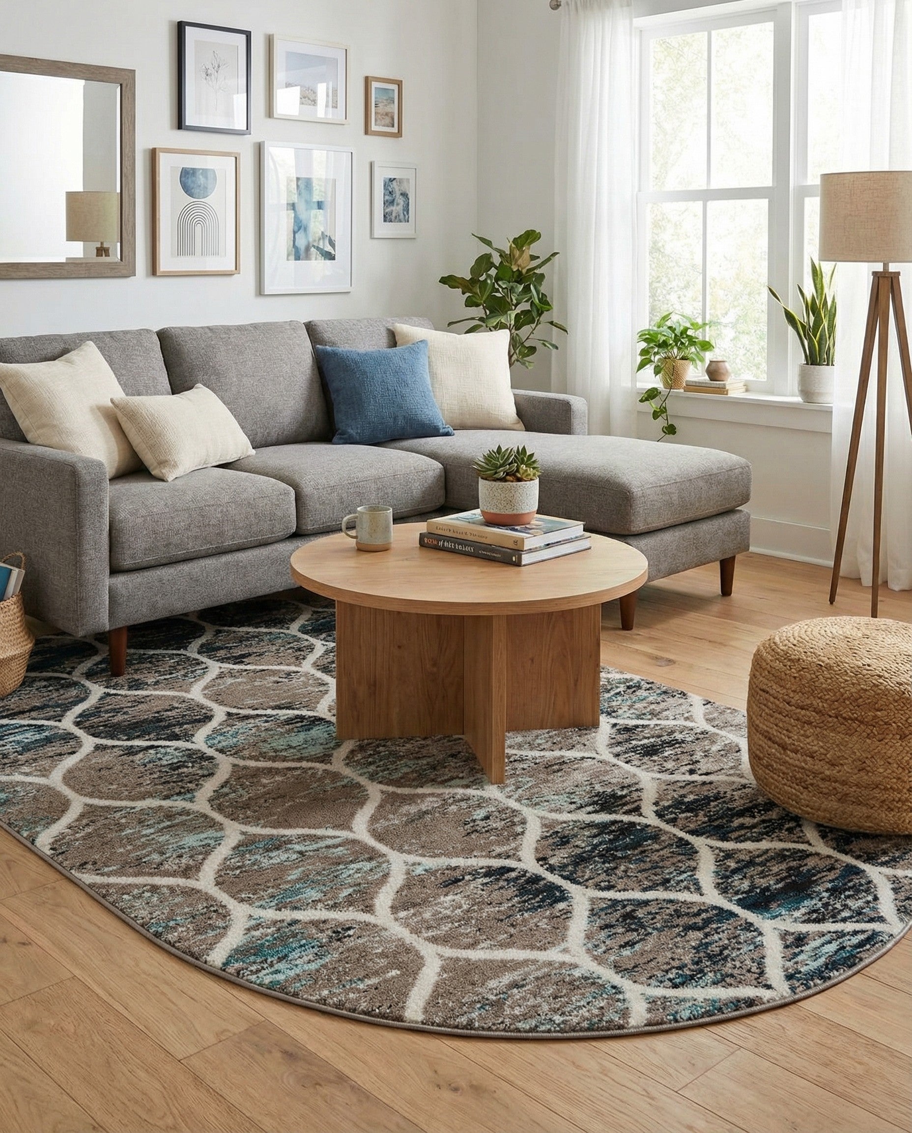 An oval 6' x 9' modern trellis rug with a distressed pattern in shades of blue, brown, and black, outlined by a white lattice design.