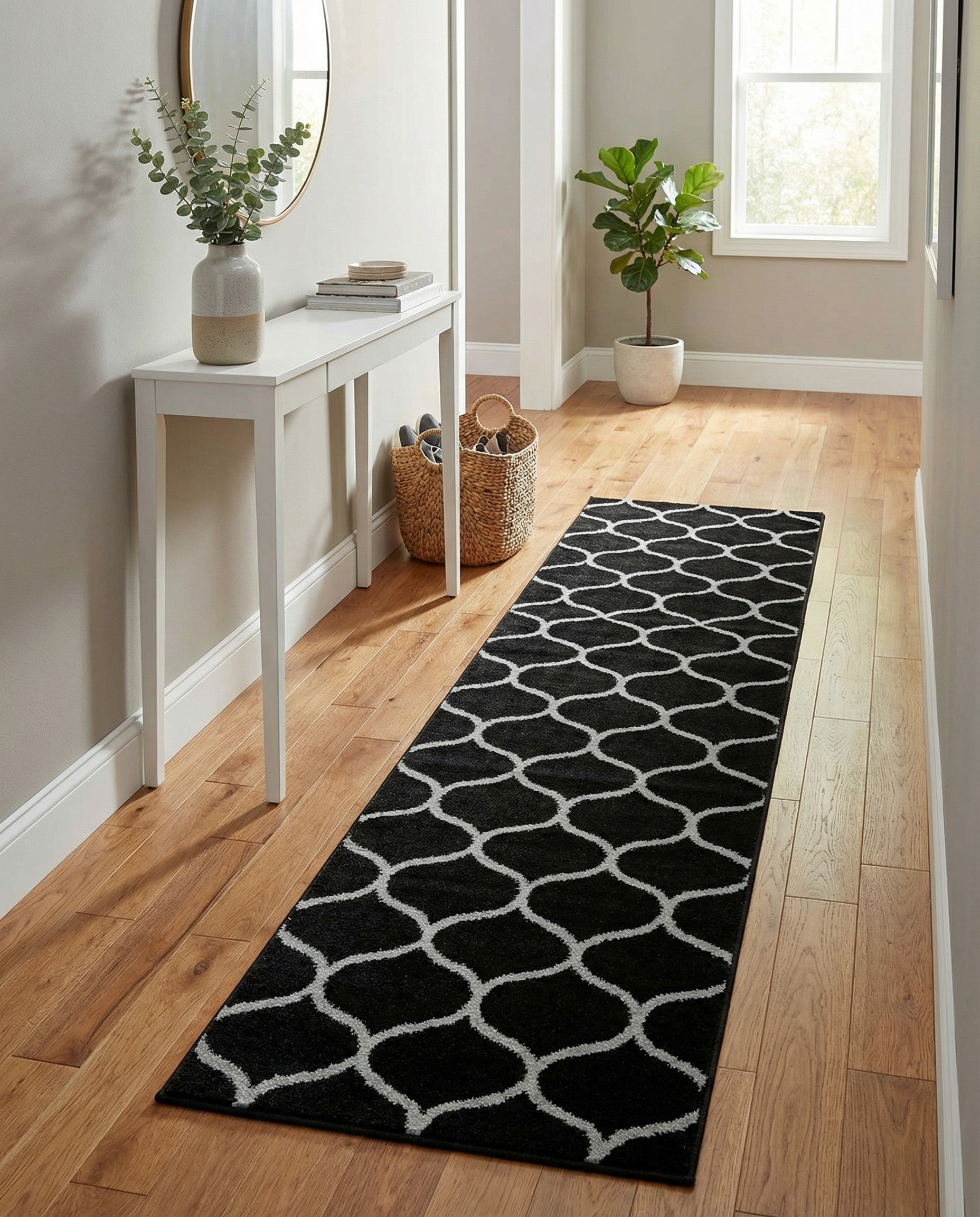 A 9 ft black runner rug with a modern white trellis pattern, ideal for a hallway.