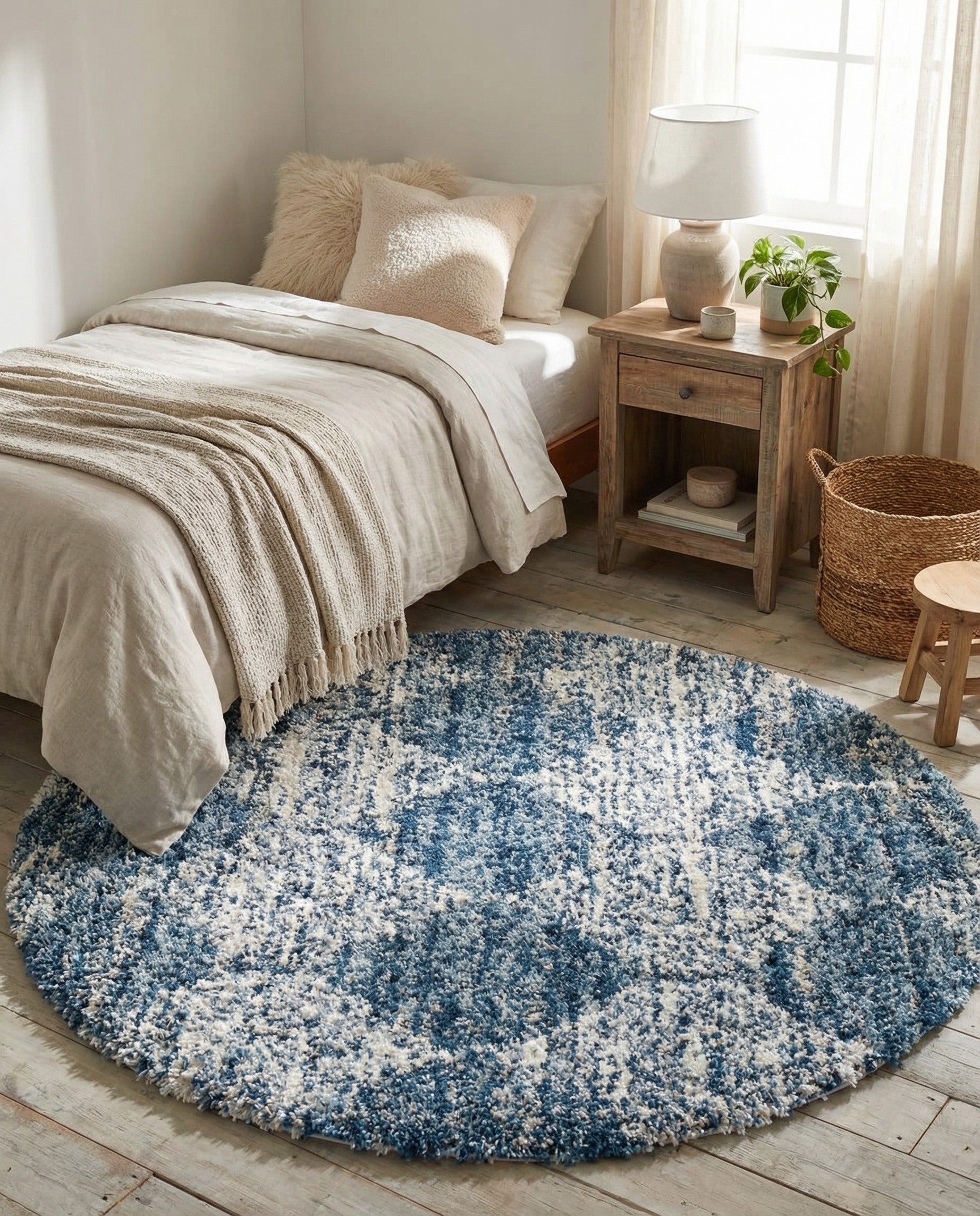 A round blue and white shag rug with a modern trellis pattern, showcasing its plush texture.