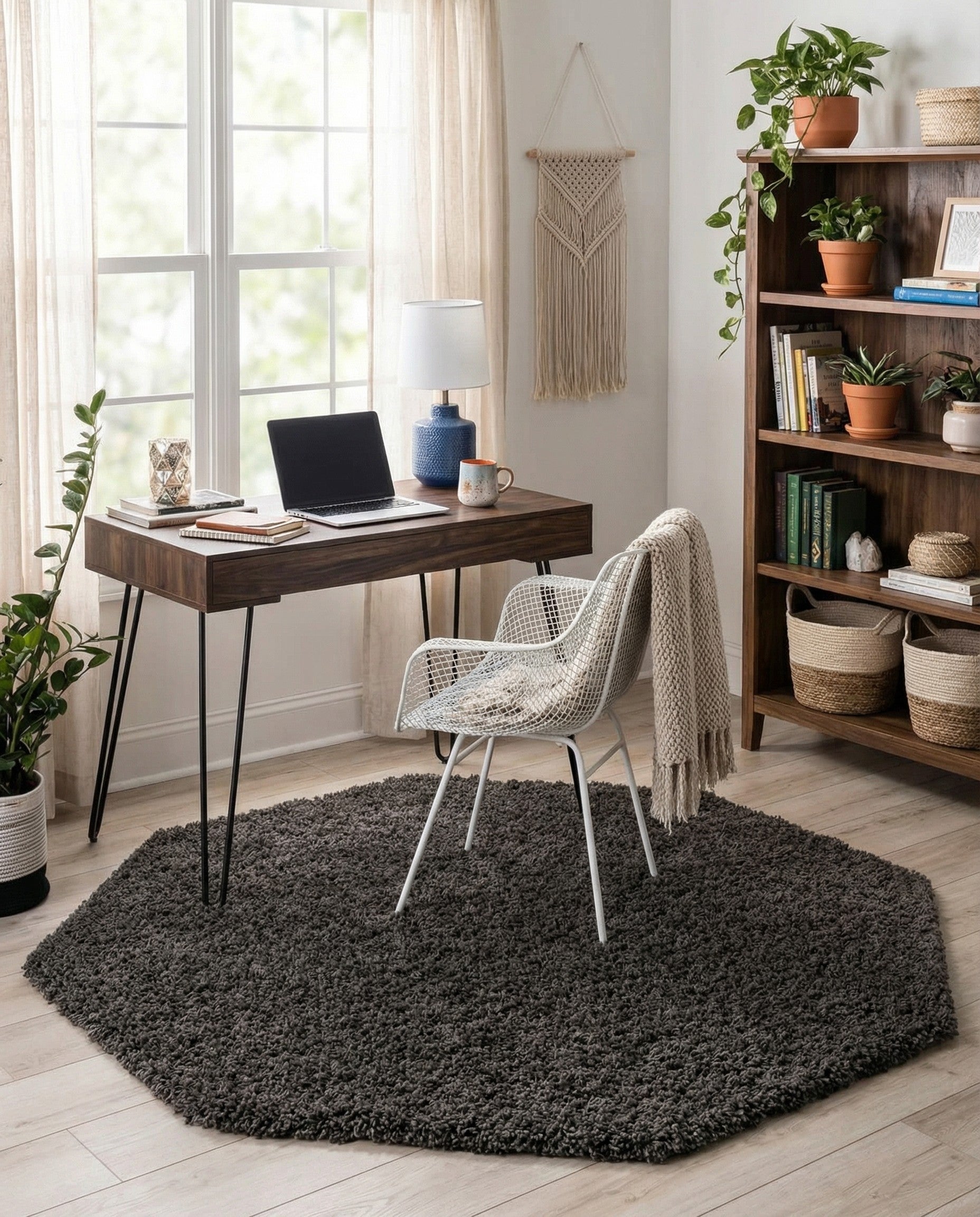 A 4' 0 x 4' 0 octagon gray shag rug with a plush, textured pile, perfect for a modern indoor space.