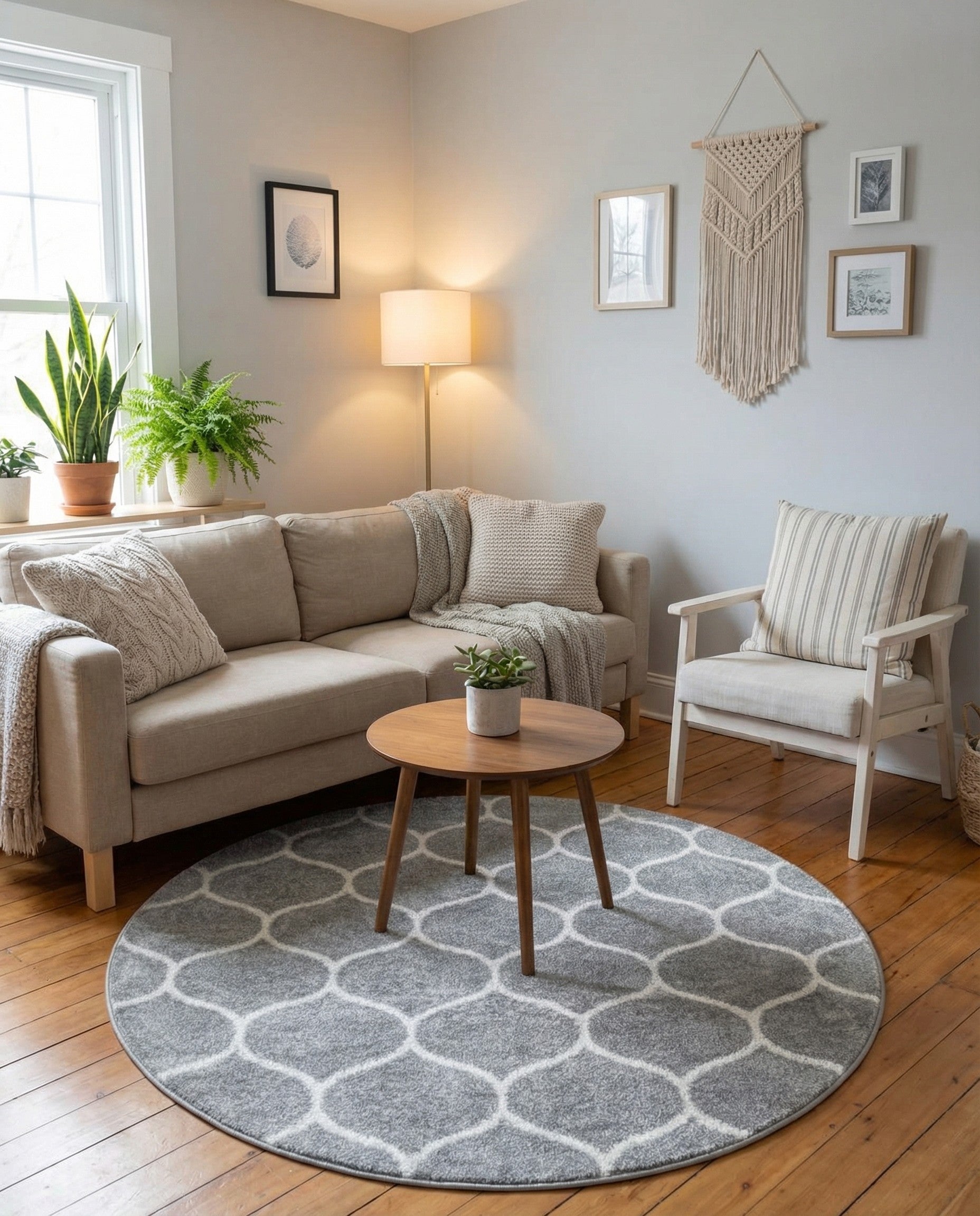 A 3' 0 x 3' 0 round gray rug with a white modern trellis pattern, suitable for indoor spaces.