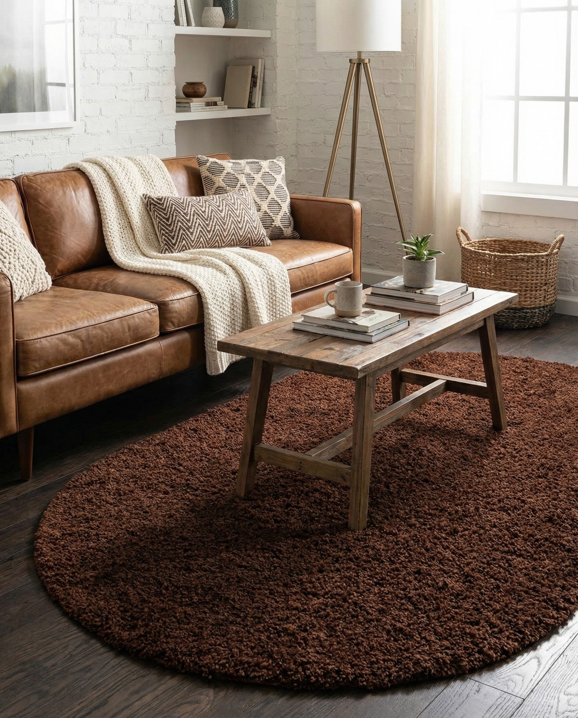 A soft, plush 3' 0 x 5' 3 oval brown shag rug with a modern, solid design, perfect for adding warmth to any indoor space.