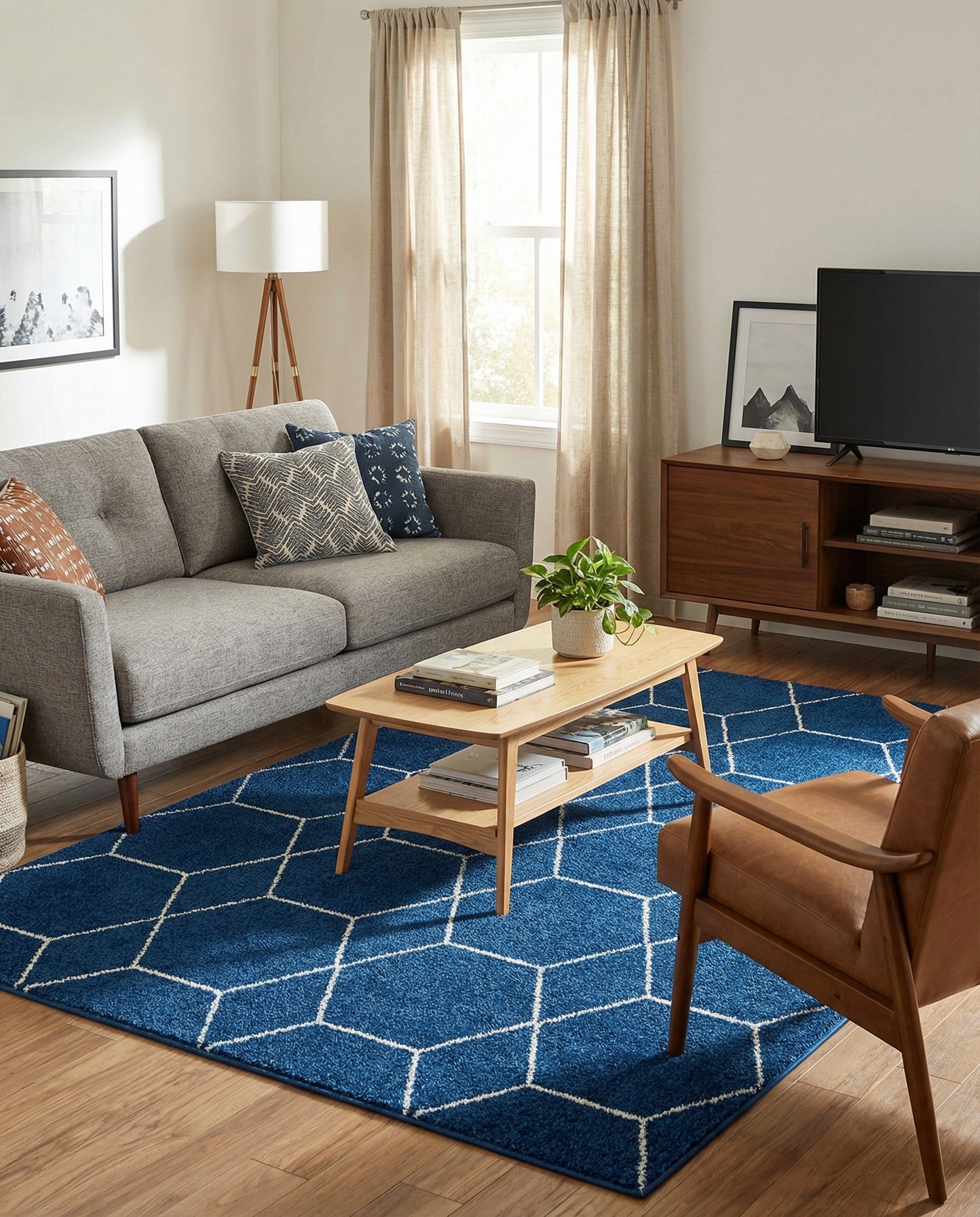 A rectangular 8x11 navy blue area rug with a repeating white geometric trellis pattern, suitable for a living room.