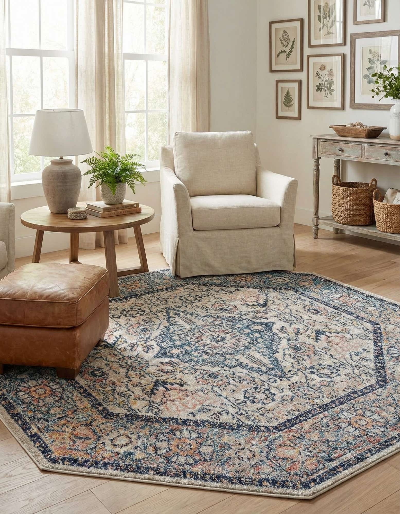 An octagon-shaped blue bohemian rug with a distressed medallion pattern and traditional border, featuring hints of orange and cream.