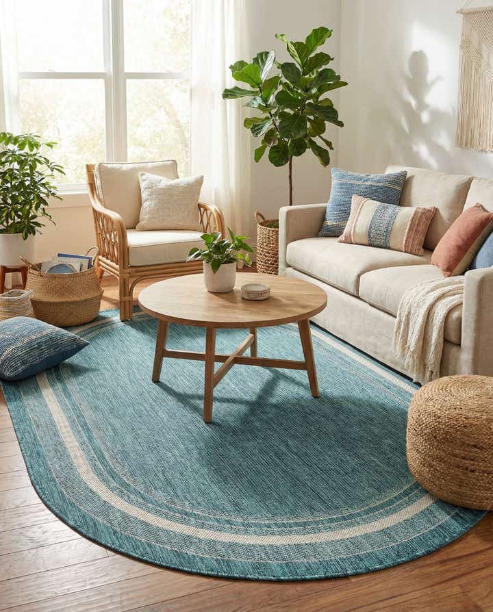 5' 3 x 8' Easy-Clean Border Indoor / Outdoor Oval Rug