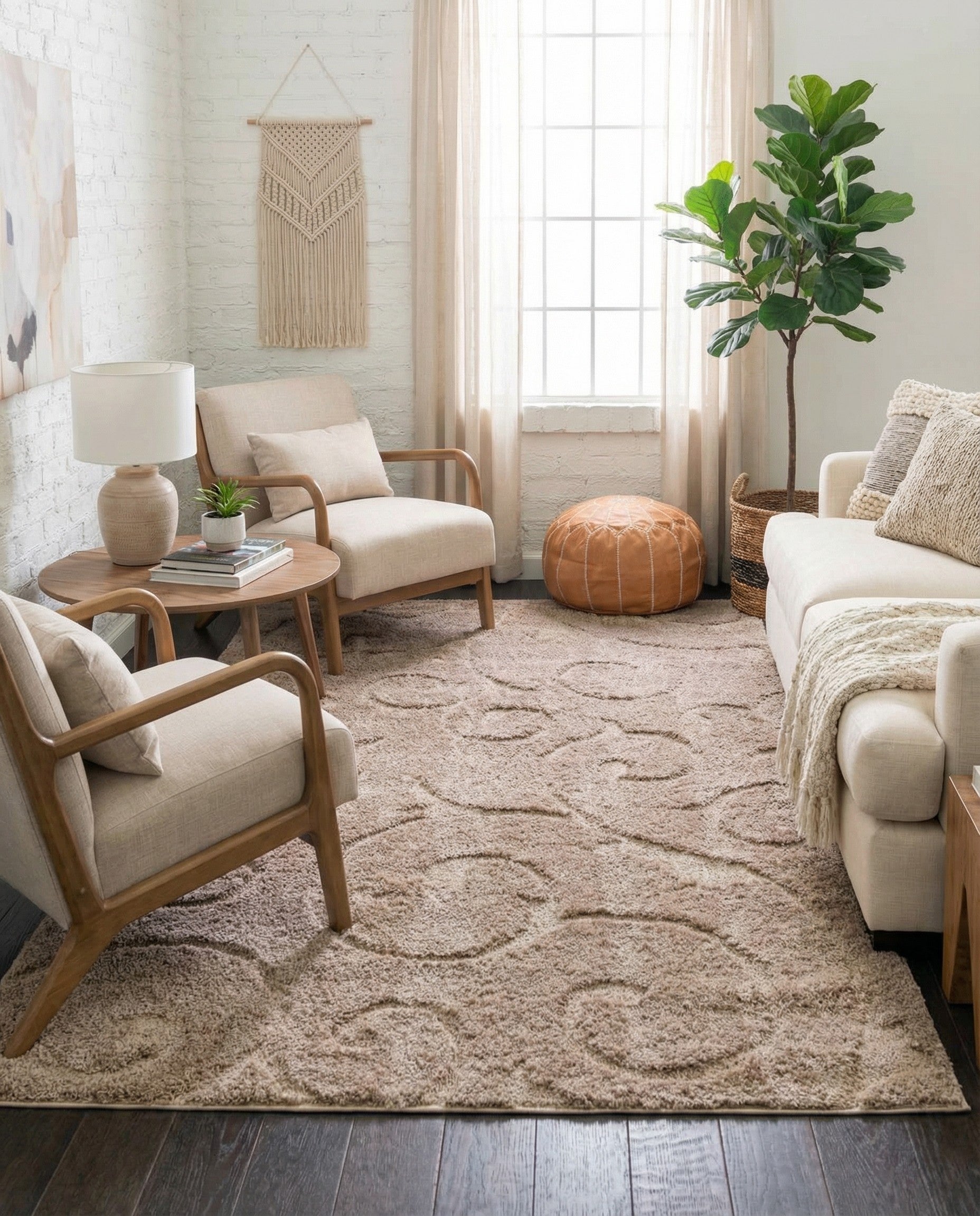 A 9x12 rectangular brown area rug featuring a subtle high/low textured pile with an elegant, contemporary botanical scroll pattern.