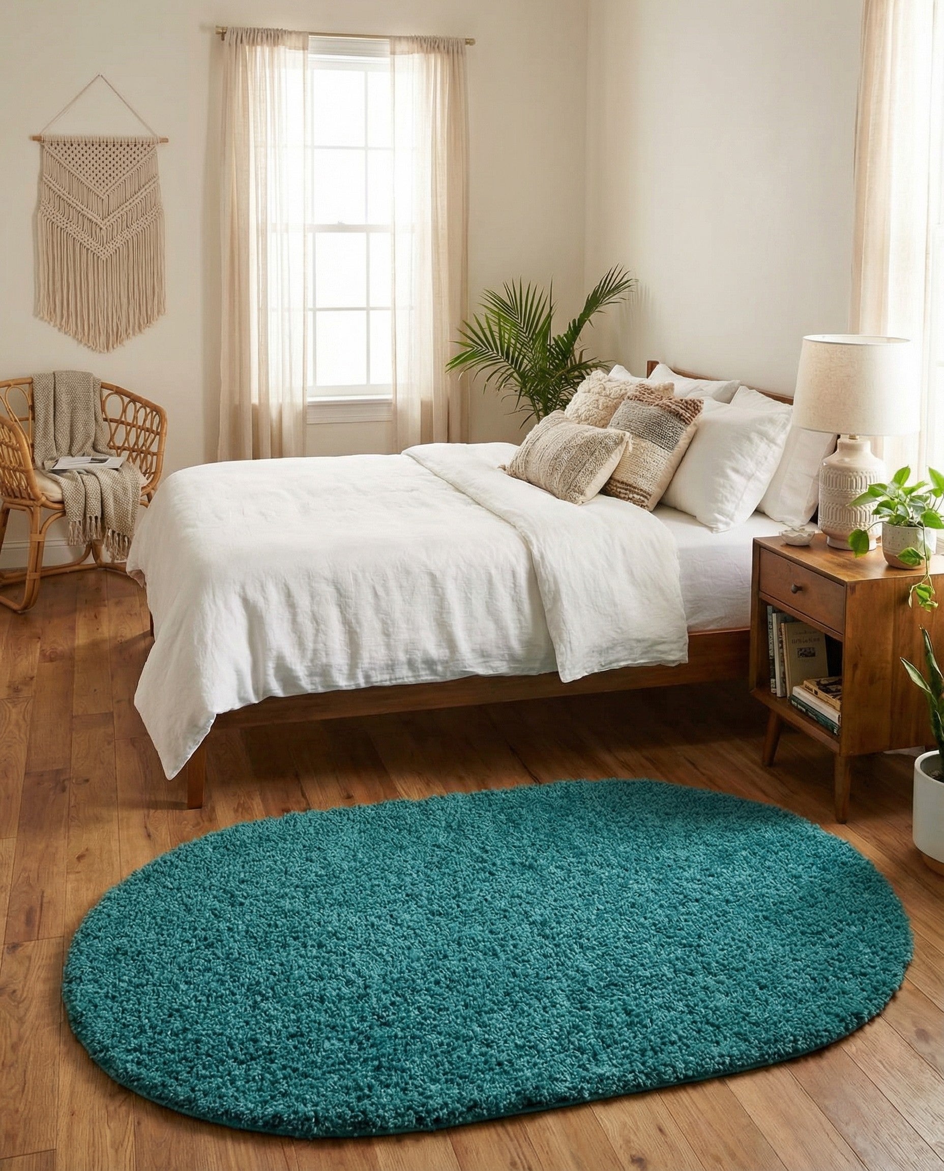 A soft, plush 3' 0 x 5' 3 oval shag rug in a vibrant blue color, perfect for a cozy indoor space.