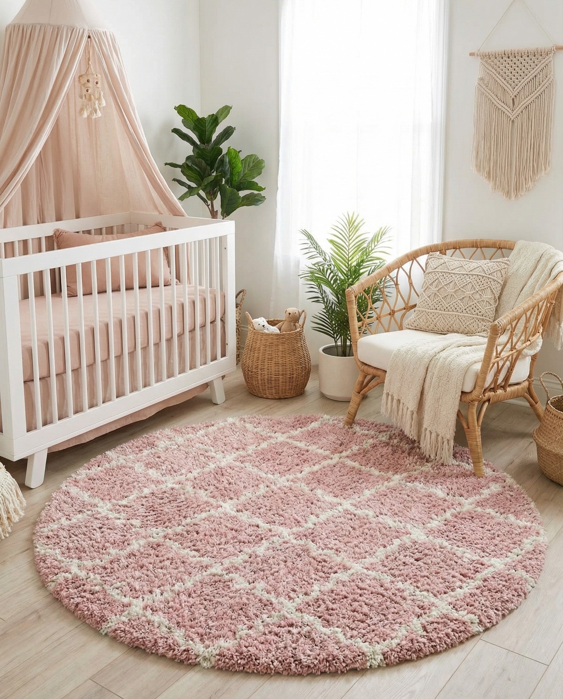 A 6' 0 x 6' 0 round pink shag rug with a subtle cream modern lattice pattern, suitable for an indoor living space.
