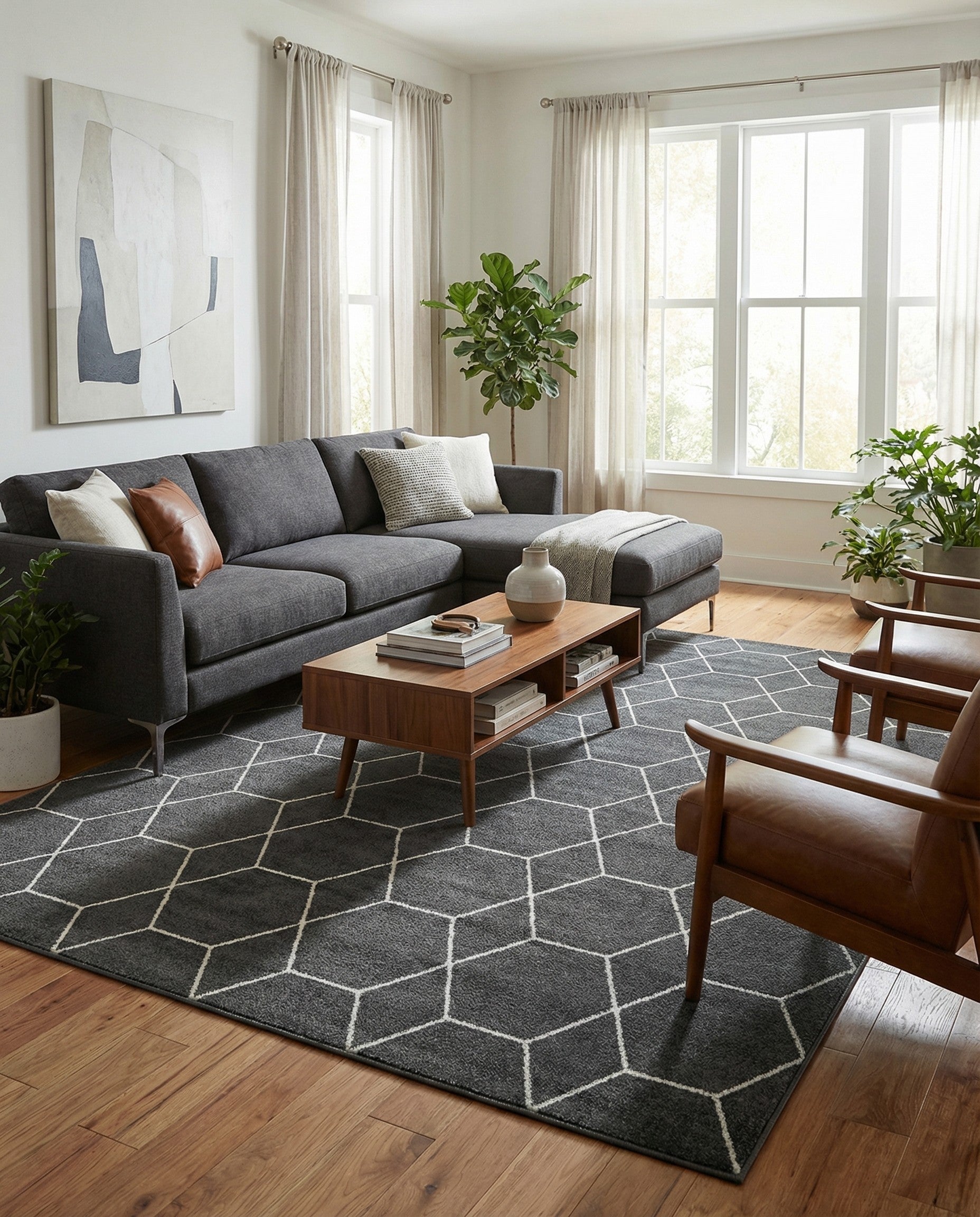 A 10x13 rectangular gray modern area rug featuring a repeating white geometric trellis pattern, suitable for a living room.