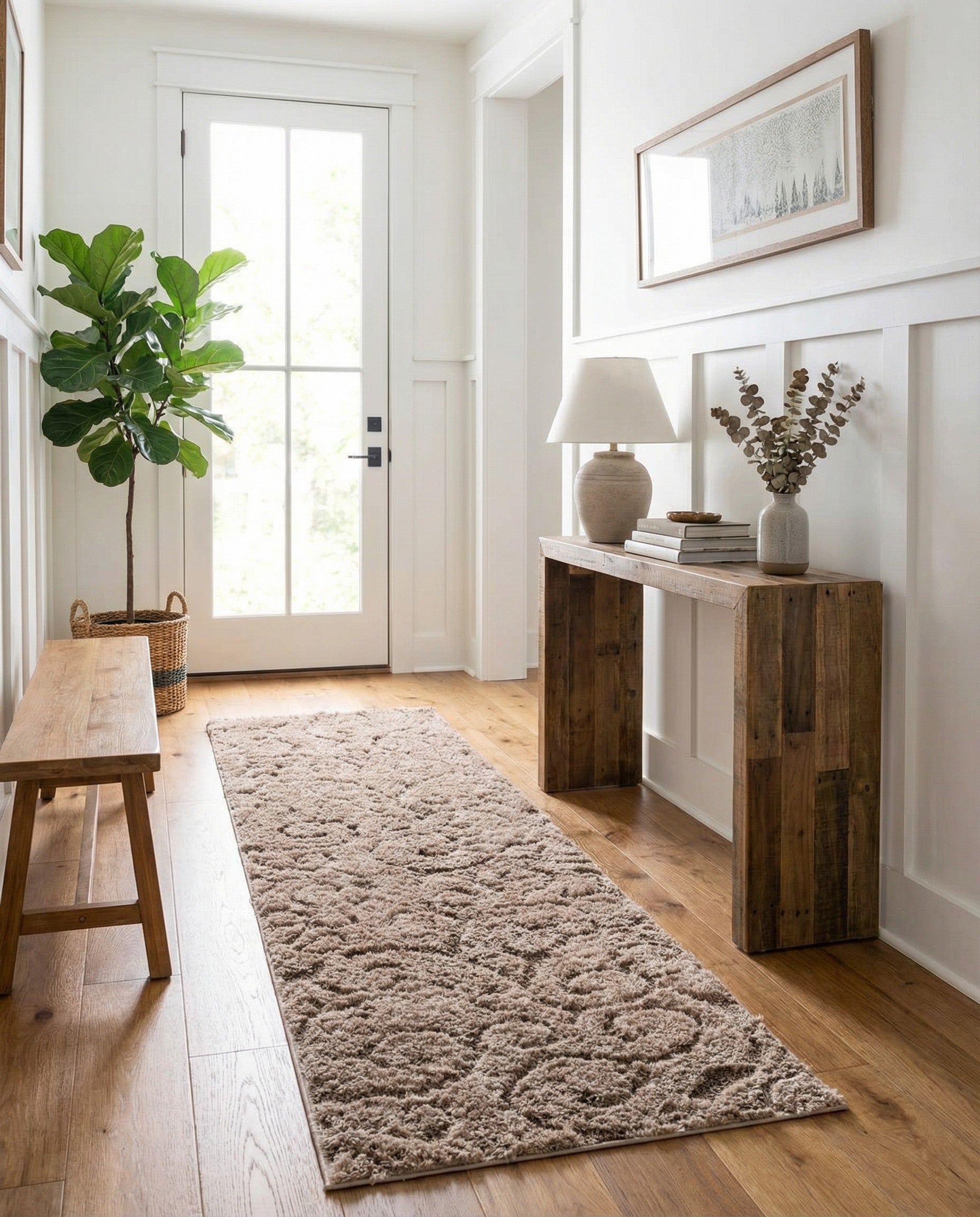 A 10 ft runner rug from the Botanical Shag collection, featuring a high/low pile in shades of brown and tan with a textured, modern pattern.