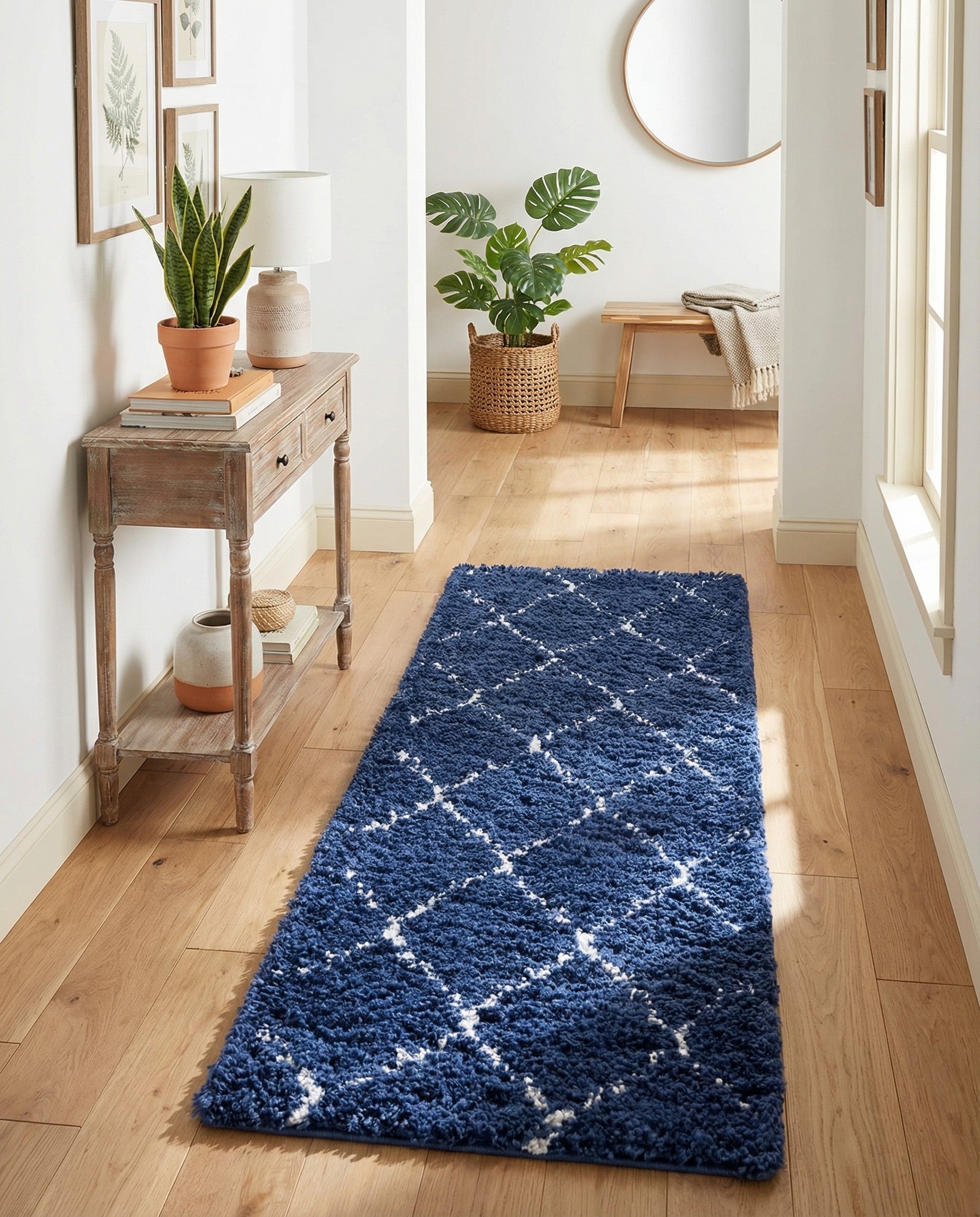 A plush navy blue shag runner rug with a white minimalist trellis pattern, ideal for a hallway.