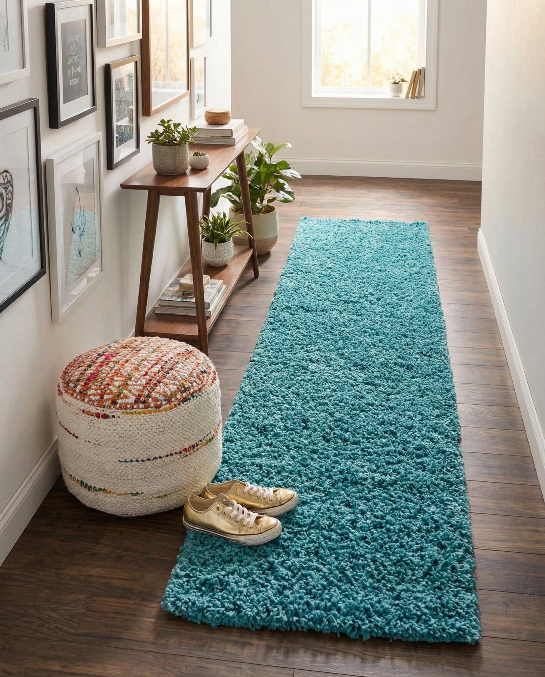 A long, rectangular 16 ft runner rug in a vibrant teal blue, featuring a plush, shaggy texture.
