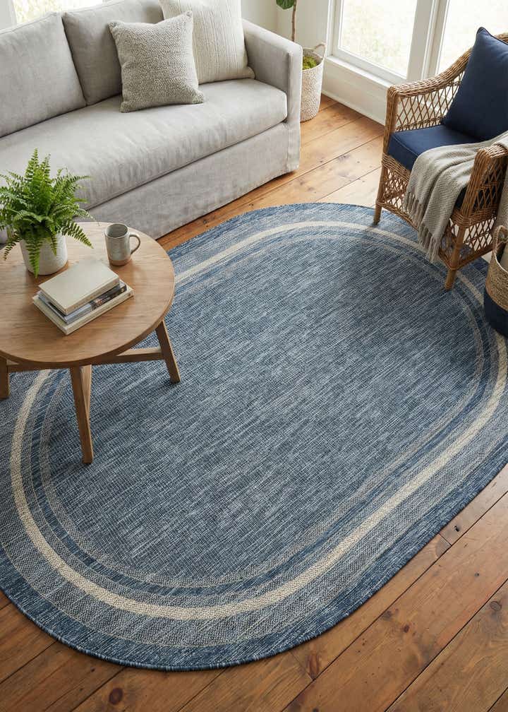 5' 3 x 8' Easy-Clean Border Indoor / Outdoor Oval Rug